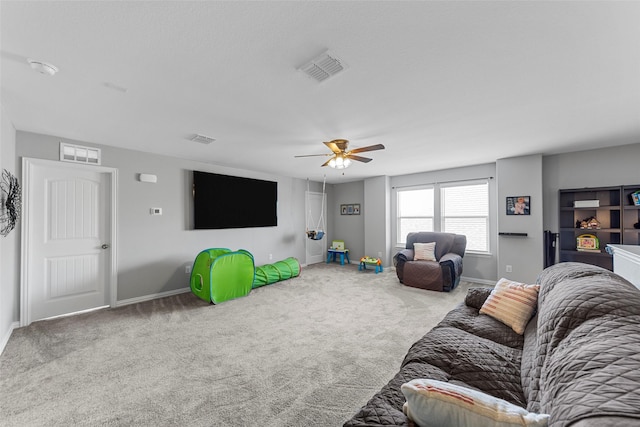 living room featuring carpet floors and ceiling fan