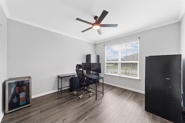 office space featuring ceiling fan, ornamental molding, dark hardwood / wood-style flooring, and beverage cooler