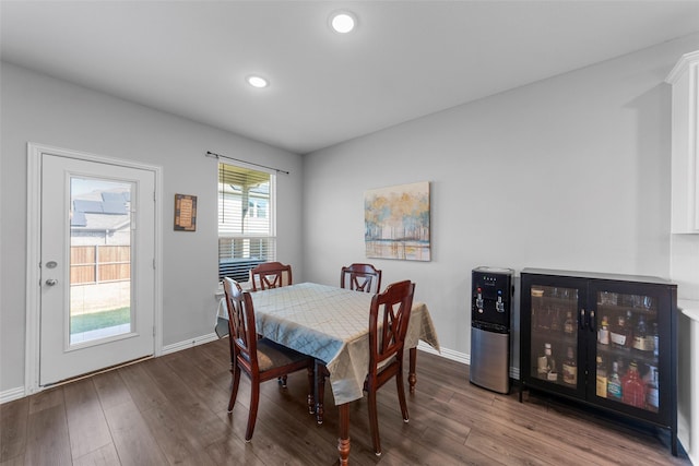 dining area featuring wine cooler and wood-type flooring