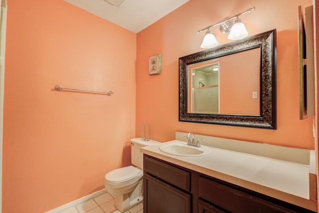 full bathroom featuring a shower with door, toilet, vanity, baseboards, and tile patterned floors