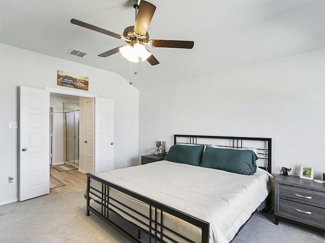 carpeted bedroom with vaulted ceiling and ceiling fan