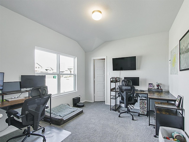 office area with vaulted ceiling and carpet