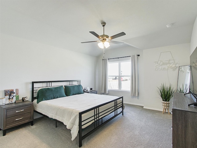 bedroom featuring light carpet, vaulted ceiling, and ceiling fan