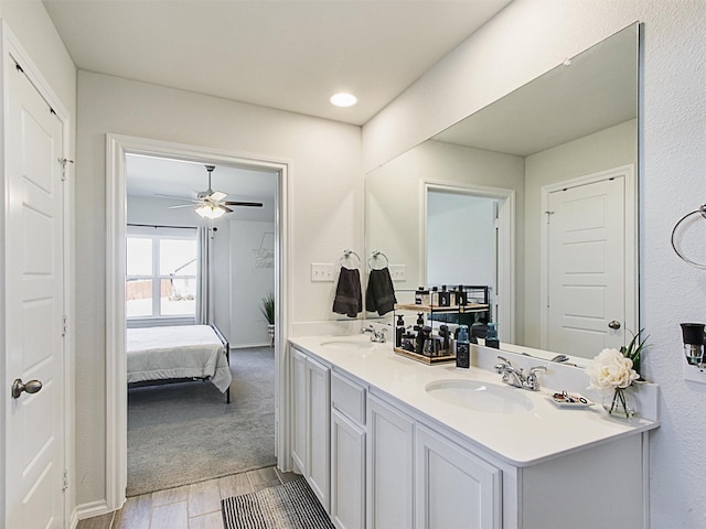 bathroom with vanity, hardwood / wood-style floors, and ceiling fan