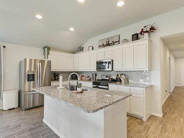 kitchen with sink, stainless steel appliances, and white cabinets