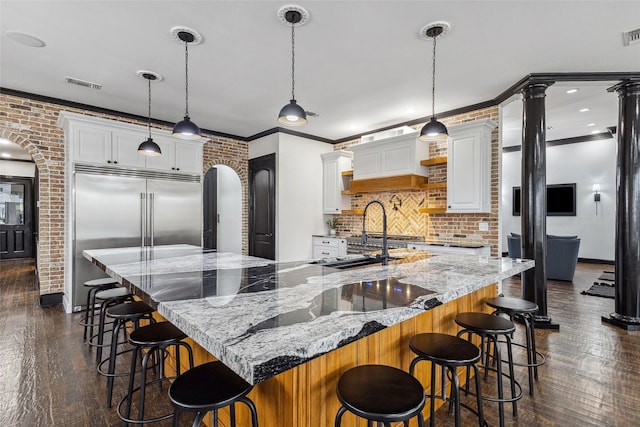 17729 Southpoint Rd, Whitehouse, TX 75791 - kitchen featuring stainless steel built in refrigerator, dark wood-style floors, tasteful backsplash, ornamental molding, and white cabinetry