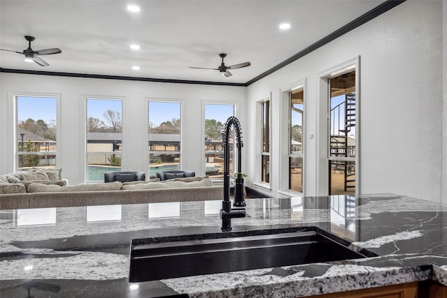 17729 Southpoint Rd, Whitehouse, TX 75791 - kitchen view of crown molding, a sink, ceiling fan, dark stone countertops, and recessed lighting