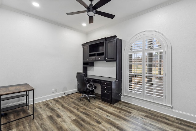 home office with ornamental molding, ceiling fan, and dark hardwood / wood-style flooring