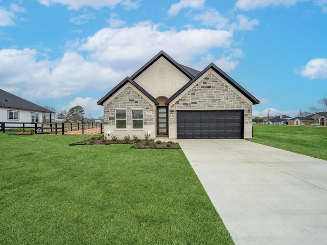 view of front of property featuring a garage and a front yard