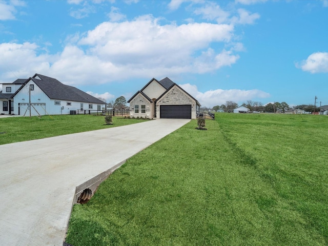 view of front of home with a garage and a front yard