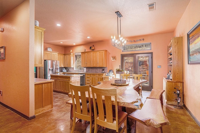 dining space featuring recessed lighting, visible vents, a notable chandelier, and a textured ceiling