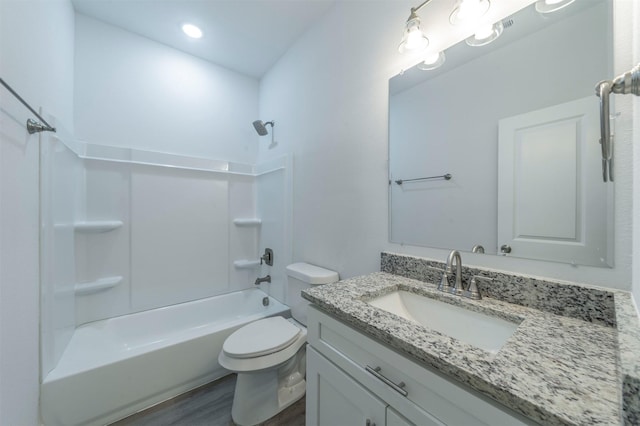 full bathroom with vanity, wood-type flooring, shower / tub combination, and toilet