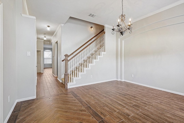 unfurnished room with crown molding and a notable chandelier