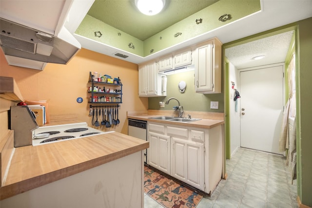 kitchen with white dishwasher, sink, white cabinetry, and range with electric cooktop