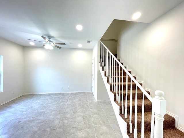 stairs with ceiling fan