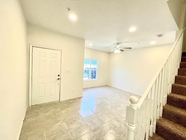 tiled foyer entrance with ceiling fan