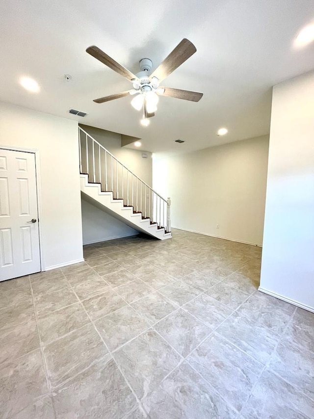 basement with ceiling fan