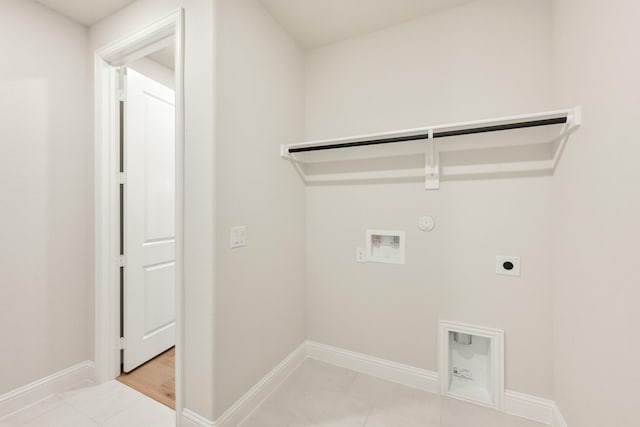 laundry room featuring washer hookup, light tile patterned floors, hookup for a gas dryer, and hookup for an electric dryer