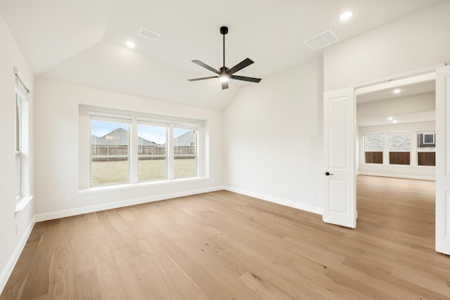 unfurnished room featuring lofted ceiling, light hardwood / wood-style flooring, and ceiling fan