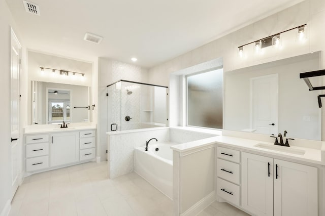 bathroom with vanity, plus walk in shower, and tile patterned flooring