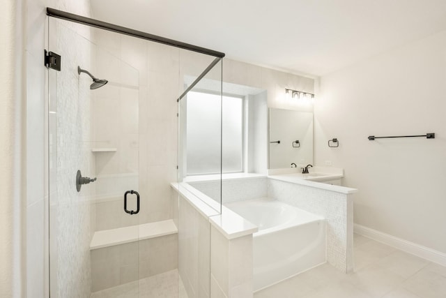 bathroom with shower with separate bathtub and sink