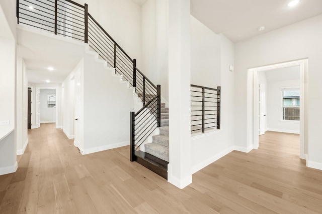 stairway featuring wood-type flooring