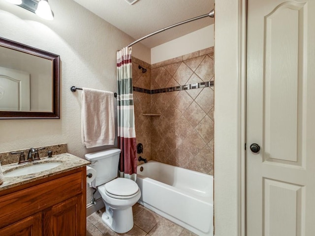 full bathroom featuring tile patterned flooring, shower / bath combo, vanity, and toilet