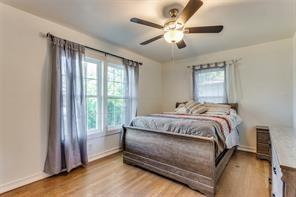 bedroom featuring ceiling fan and light hardwood / wood-style flooring