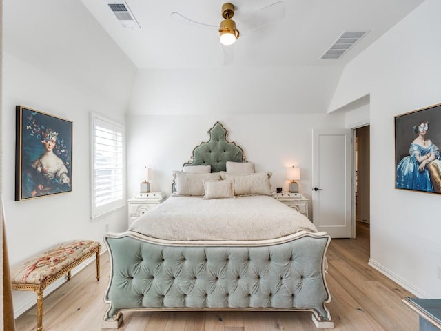 bedroom with ceiling fan, lofted ceiling, and light wood-type flooring