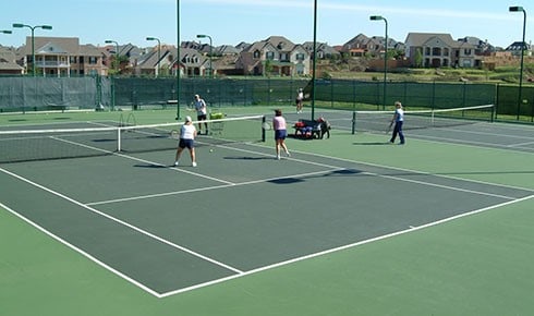 view of tennis court featuring basketball court