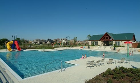 view of pool with a patio and a water slide