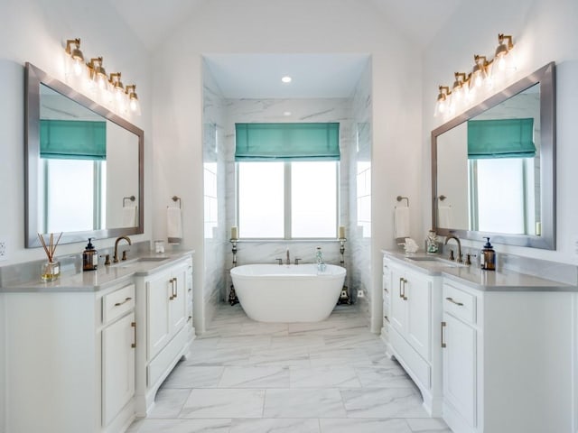 bathroom featuring a bathing tub and vanity