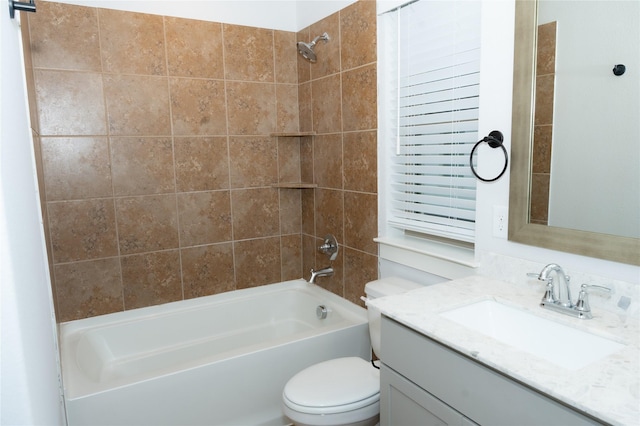 full bathroom featuring vanity, toilet, and tiled shower / bath combo