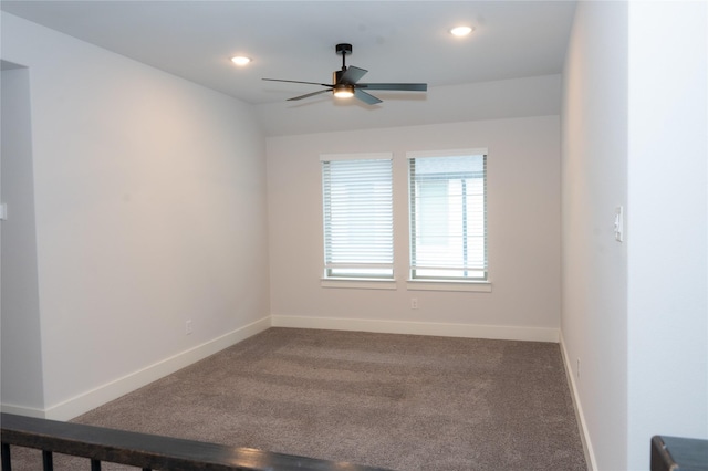 empty room with carpet floors and ceiling fan