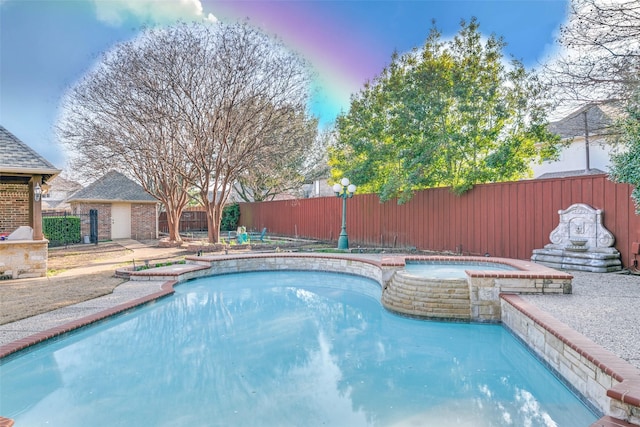 view of pool with a pool with connected hot tub and a fenced backyard