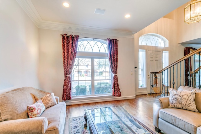 7405 Sugarbush Dr, Garland, TX 75044 - living room featuring ornamental molding, wood finished floors, stairs, recessed lighting, and a chandelier