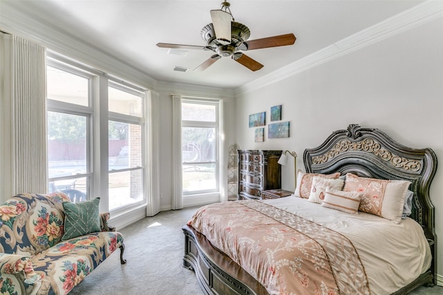 bedroom featuring carpet floors, ceiling fan, visible vents, and crown molding