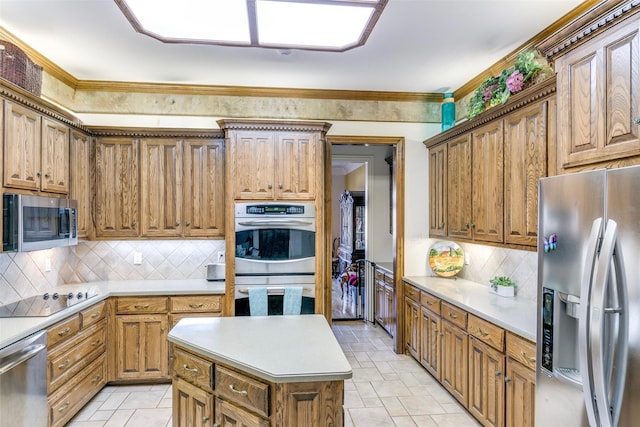 7405 Sugarbush Dr, Garland, TX 75044 - kitchen featuring appliances with stainless steel finishes, tasteful backsplash, light countertops, a kitchen island, and brown cabinetry