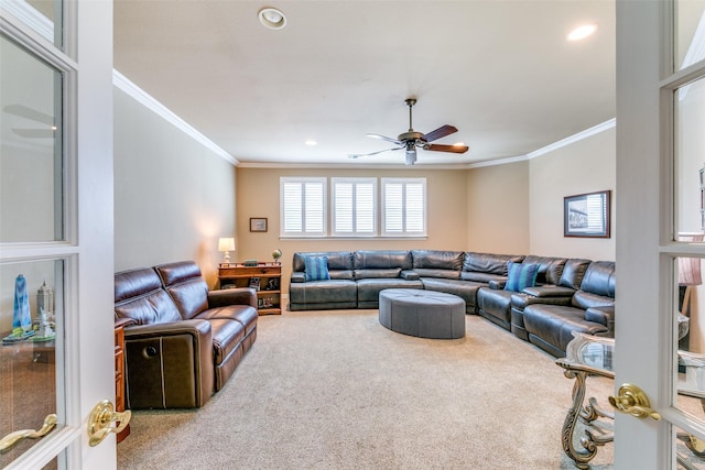 carpeted living area featuring ceiling fan, recessed lighting, and crown molding