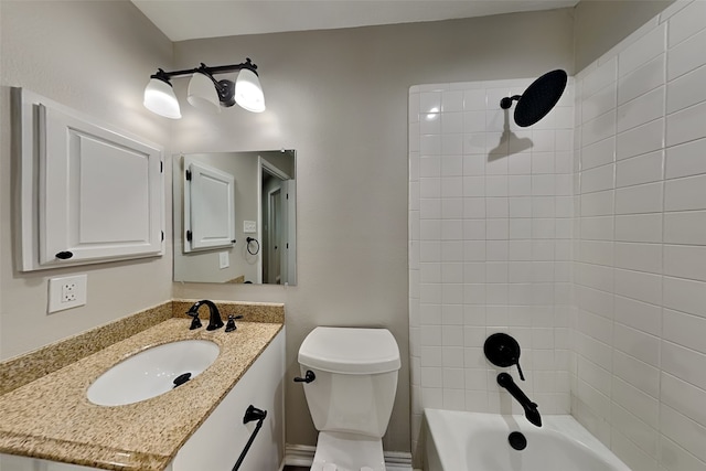 full bathroom with vanity, toilet, and tiled shower / bath