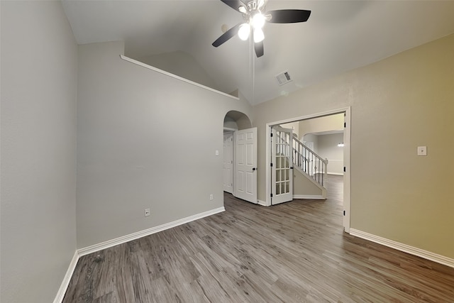 spare room with ceiling fan, lofted ceiling, and light hardwood / wood-style flooring