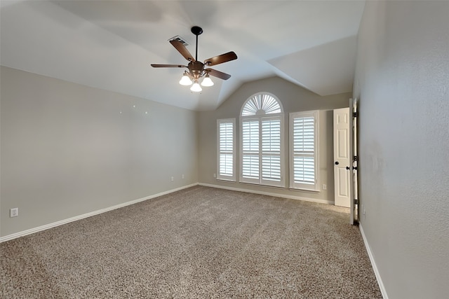 carpeted empty room with lofted ceiling and ceiling fan