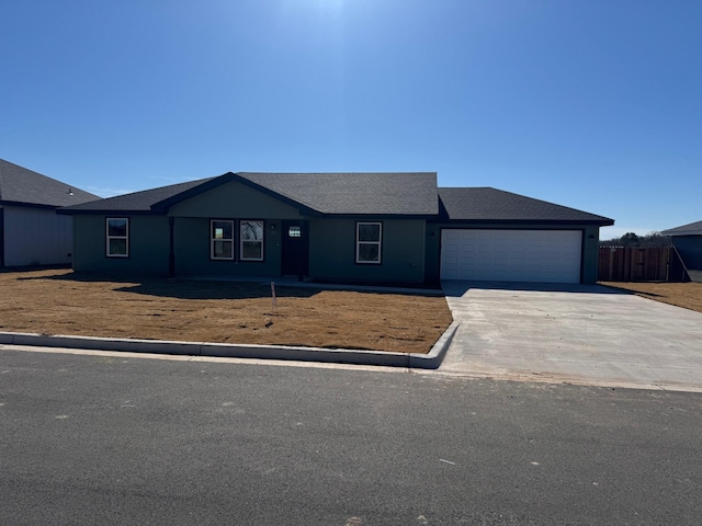 ranch-style home featuring a garage