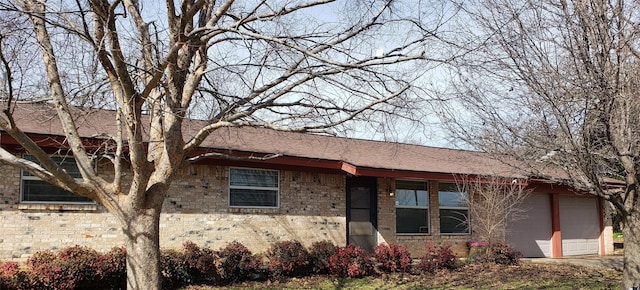 single story home featuring a garage