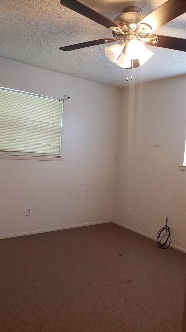 1802 SE 26th Ave, Mineral Wells, TX 76067 - carpeted empty room featuring a ceiling fan, a textured ceiling, and baseboards