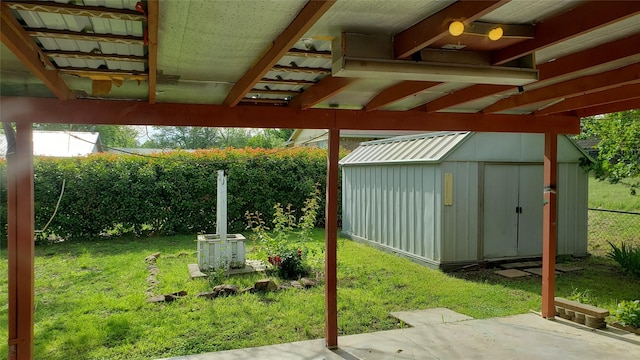 1802 SE 26th Ave, Mineral Wells, TX 76067 - view of yard featuring a storage unit, an outdoor structure, and a patio