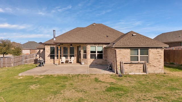 back of house featuring a yard, a patio, and ceiling fan