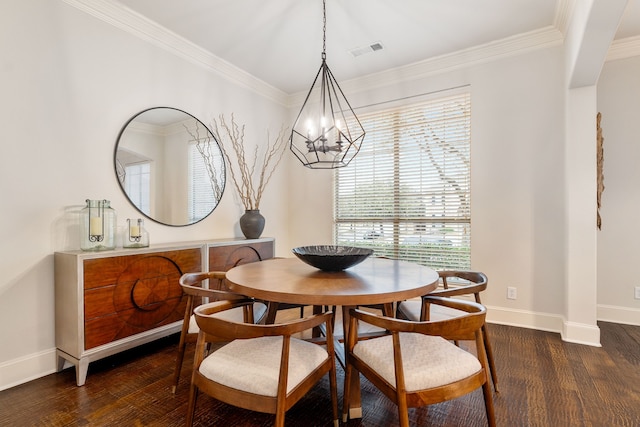 dining room with dark hardwood / wood-style flooring, ornamental molding, and a chandelier