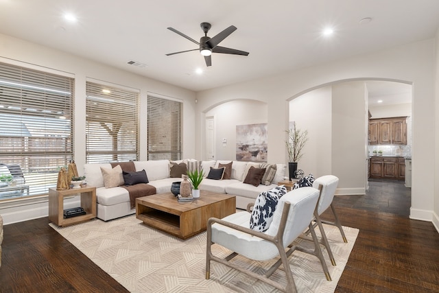 living room featuring light hardwood / wood-style flooring and ceiling fan