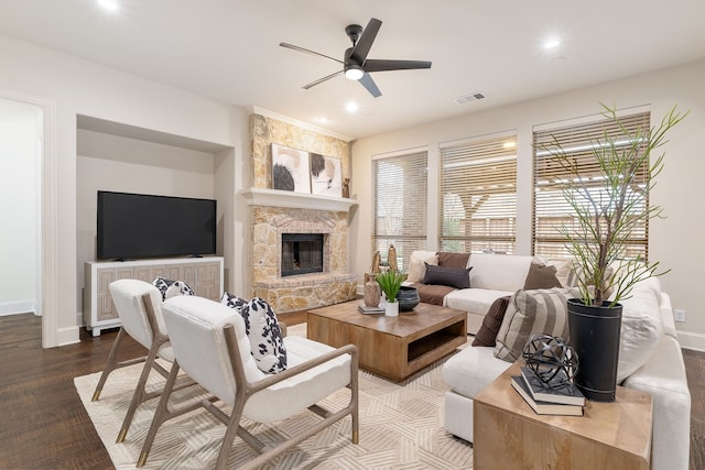 living room with hardwood / wood-style floors, a fireplace, and ceiling fan